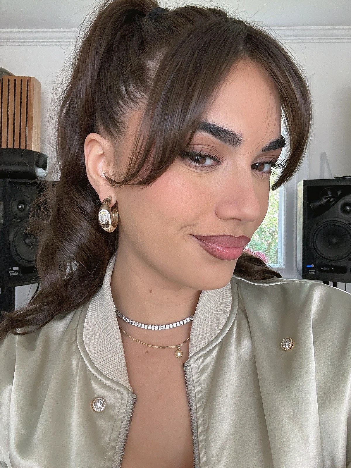 Close shoulder-up candid portrait of a fictional pop / contemporary r&b singer in her own music recording studio