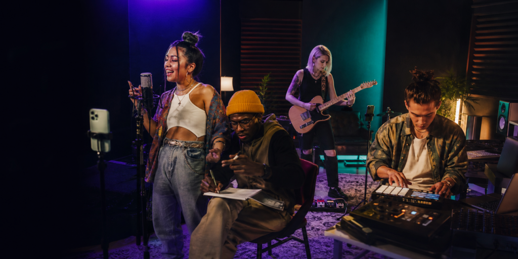 Pop, hip-hop, alternative rock and electronic musicians creating music and social content together in a studio